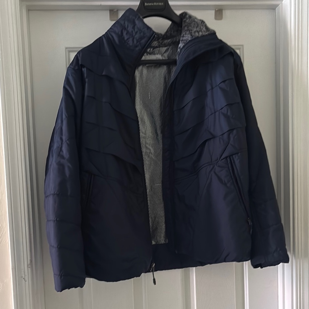 Columbia Blue Puffer Jacket with High Collar and Water-Resistant Material